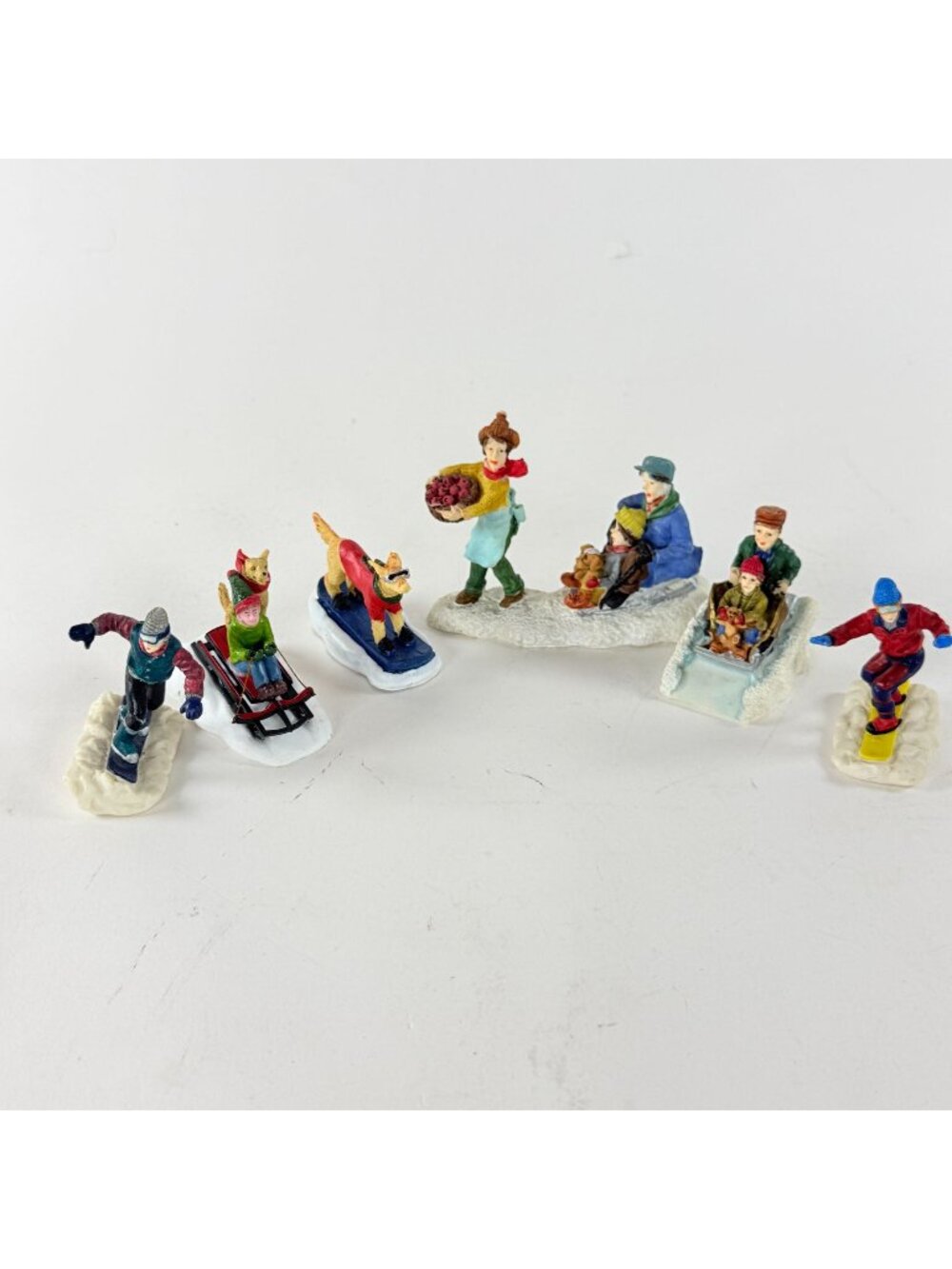 Christmas Village Lot 6 Figurines Winter Scene Family Sledding Dog Snowboard